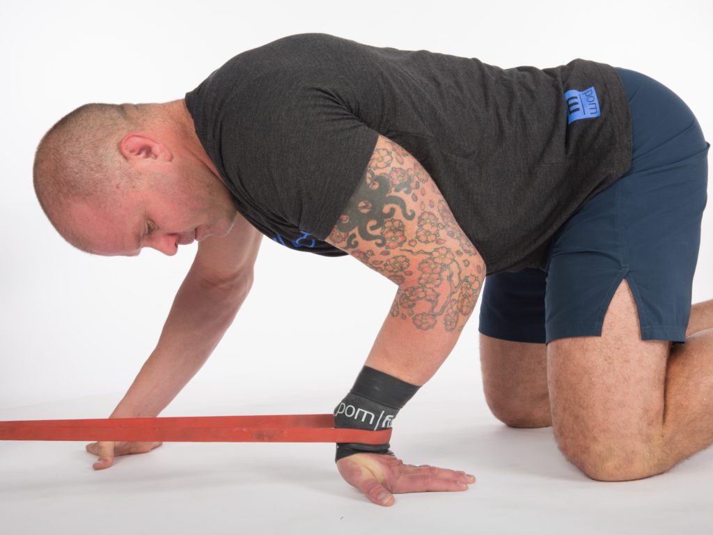 3. Banded wrist distraction with Voodoo 3 Hip Mobility Exercise Couch Stretch
