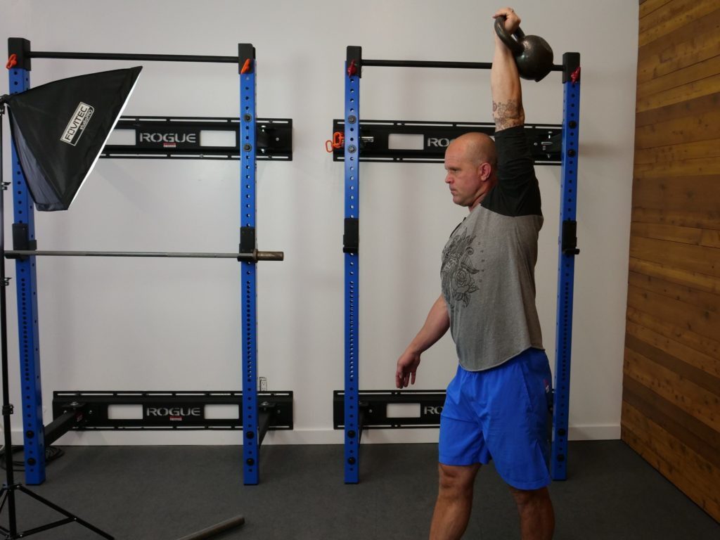 3. Overhead kettlebell carry Hip Mobility Exercise Side Hip Smash