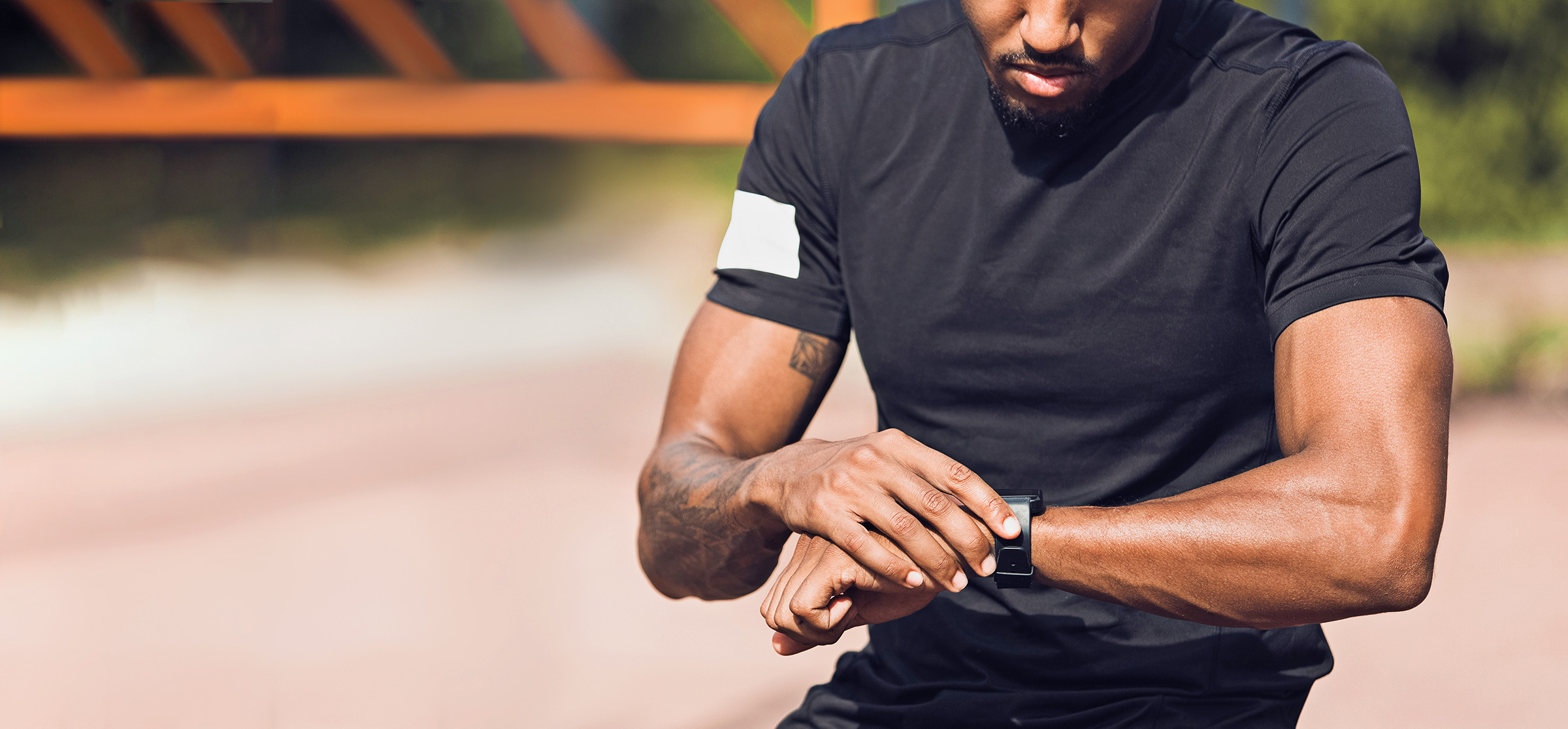 Sporty Man Checking Heart Rate On Smartwatch, Crop Two Professional Fencers Show Masterful Swordsmanship in their Foil Fight. They Attack, Defend, Leap and Thrust and Lunge. Shot Isolated on Black Background.