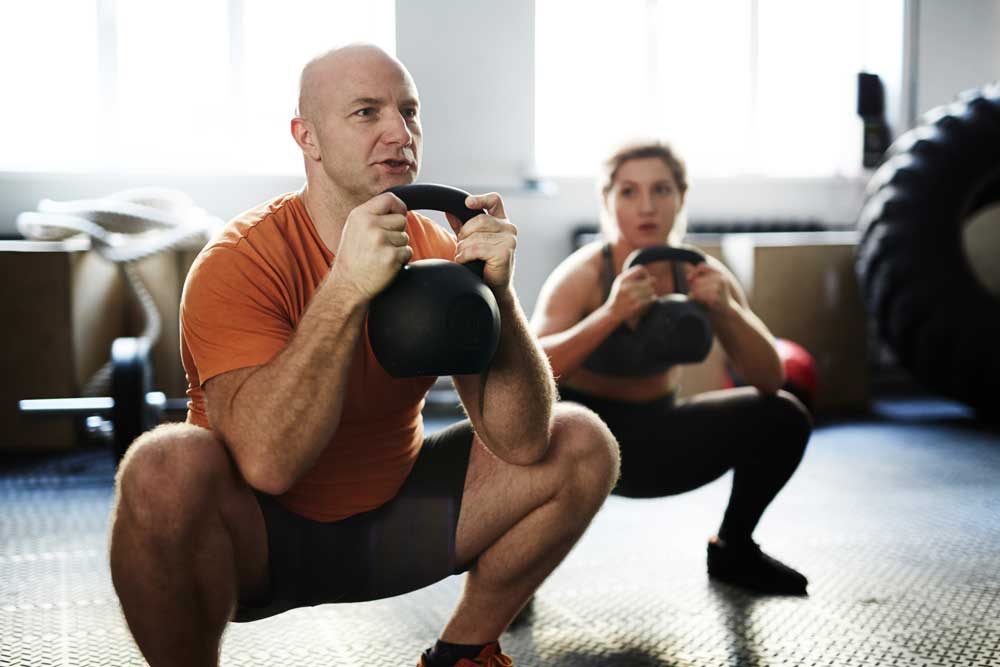 Man-and-woman-goblet-squat Goblet squats