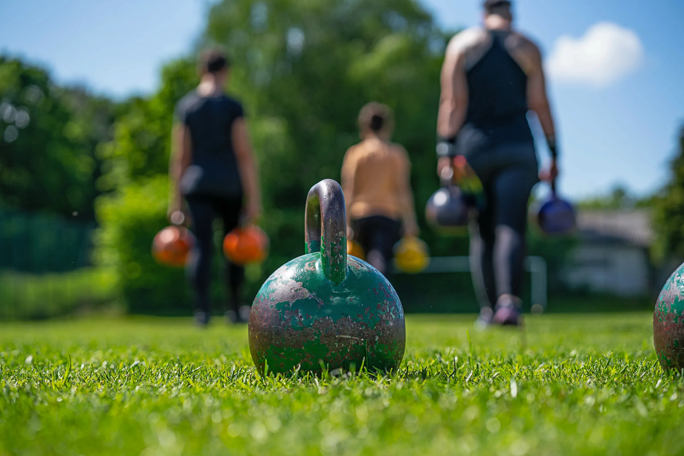 kettlebells in green grass - fitness concept outdoors kettlebells in green grass - fitness concept outdoors